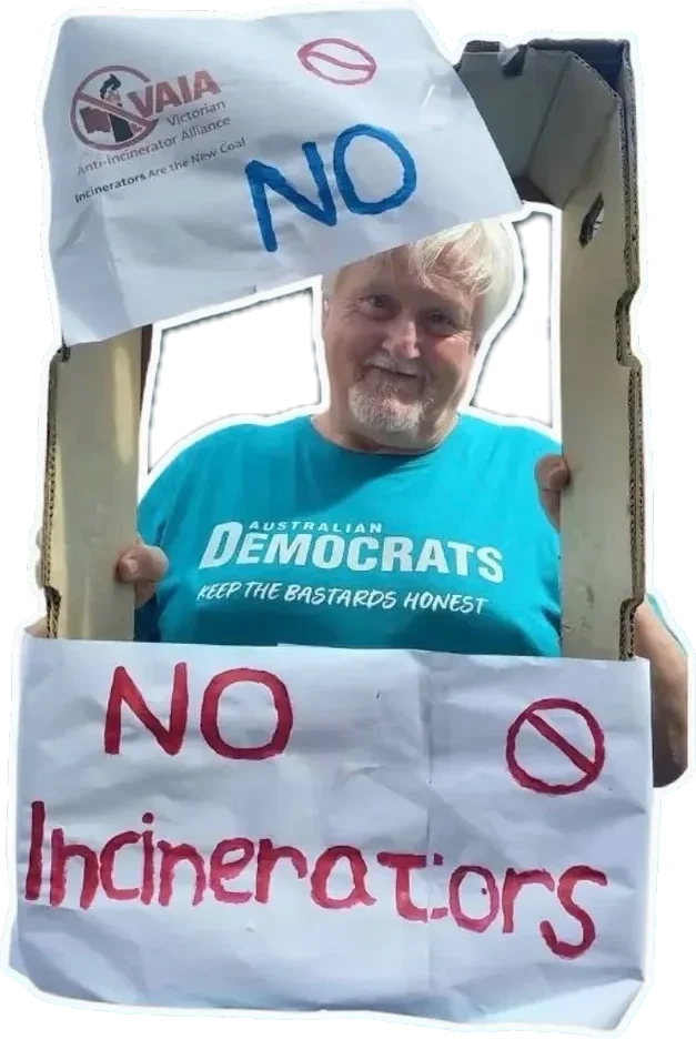David in an Australian Democrats T-shirt, framed by a cardboard "No Incinerators" sign