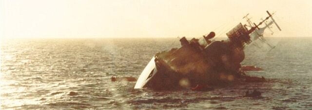 Air Defence Destroyer HMS Coventry sinks after being hit by two dumb bombs in 1982 (UK MoD).